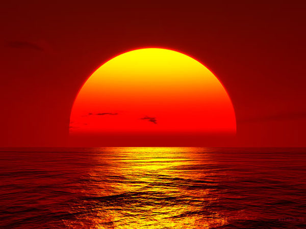 sunset-big-orange-sun-setting-over-ocean_0 alternate text for this image