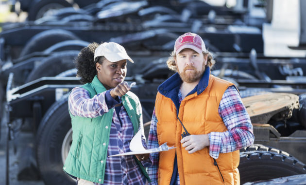 Workers at trucking company alternate text for this image