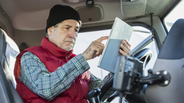 older truck driver in cab