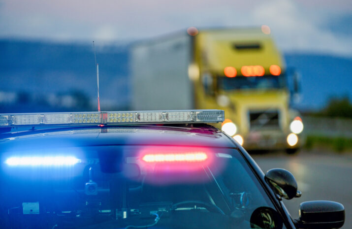 picture of cop car and truck