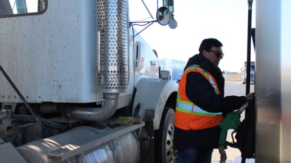 Truck driver fueling alternate text for this image