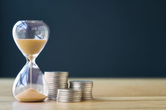 Time and stack of coins.
