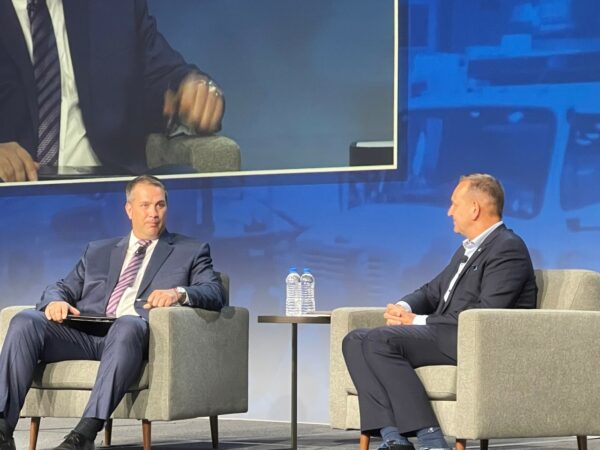 Erik Neandross of Gladstein, Neandross and Associates, talks electric vehicles with Volvo's Peter Voorhoeve