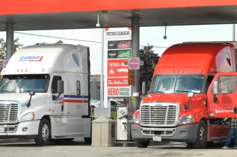 Picture of trucks fueling at a truck stop.