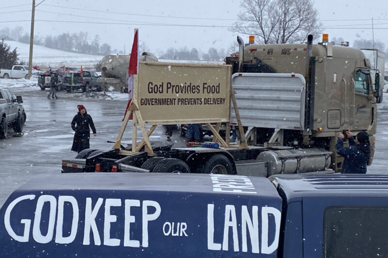 anti-vaccine signs on trucks