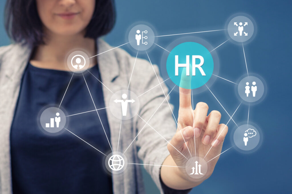 Businesswoman pressing human resources button on digital touch screen. Human resource management concept.