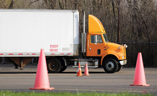 Student truck driver practices parking maneuvers alternate text for this image
