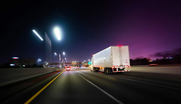 Truck Miami Florida highway at night with deliveries alternate text for this image