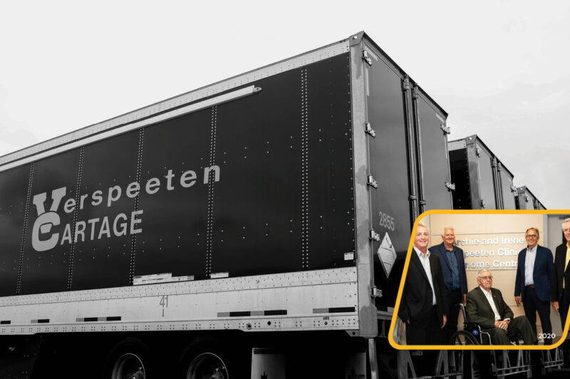 The Verspeeten family pictured with trucks