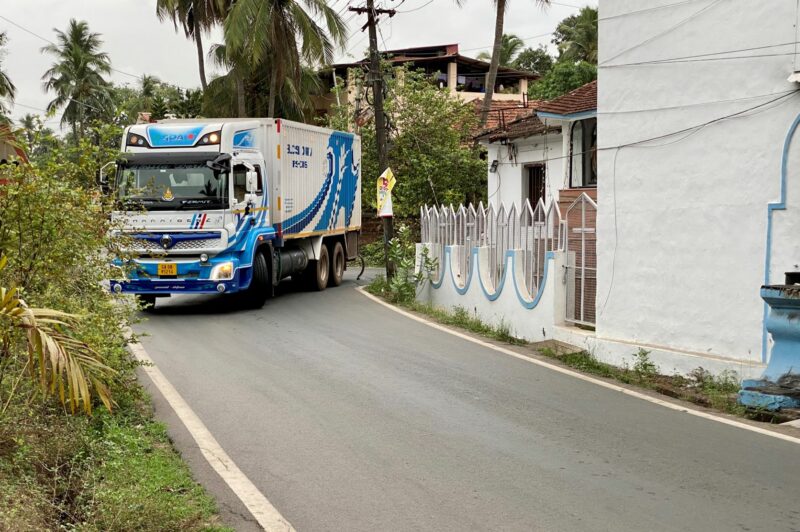 Truck takes a tight corner in Goa, India.