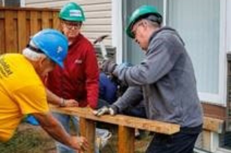 Picture of people helping construct a home