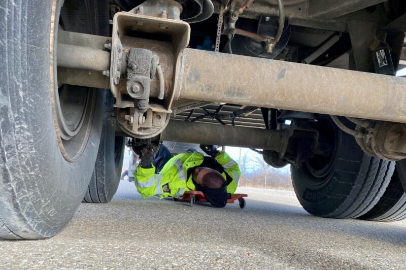 Picture of officer inspecting a truck