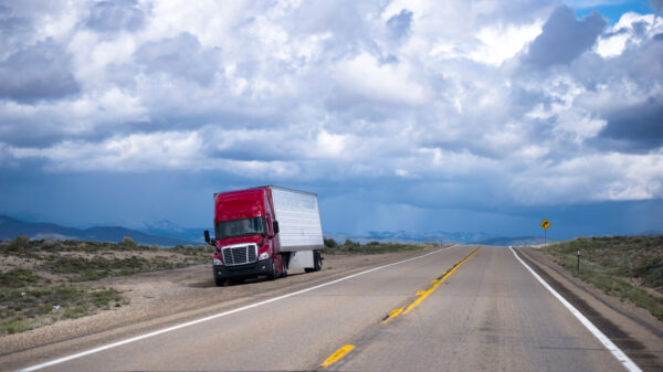 Out of road red semi truck and trailer awesome view alternate text for this image