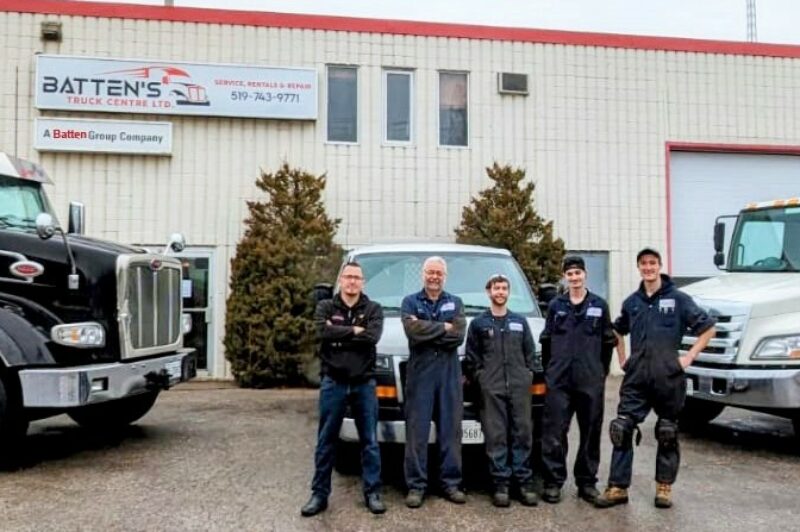 Men standing in front of Batten's Truck Center
