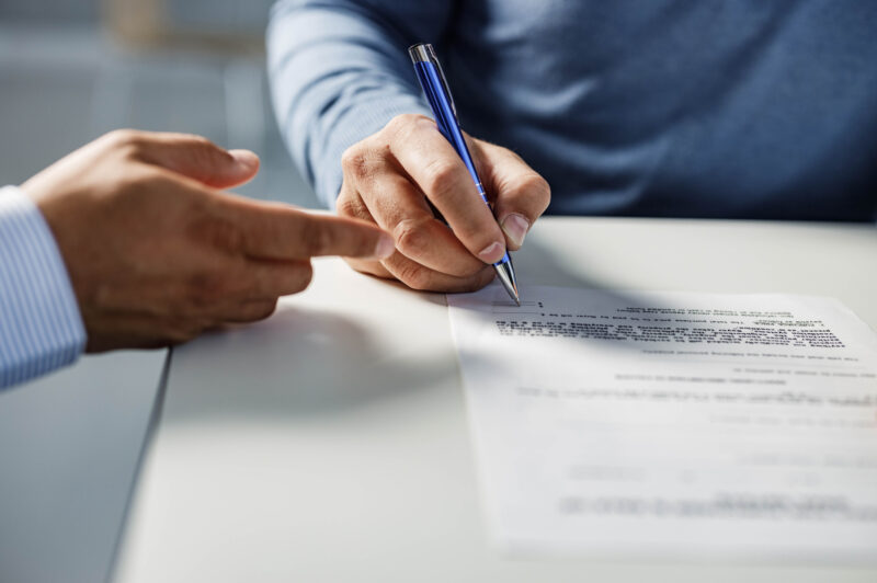 Person signing a contract