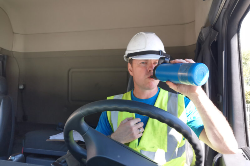 Truck driver drinking water