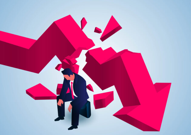 Broken arrow graph and downcast businessman, bankruptcy, economic crisis, loss of income alternate text for this image