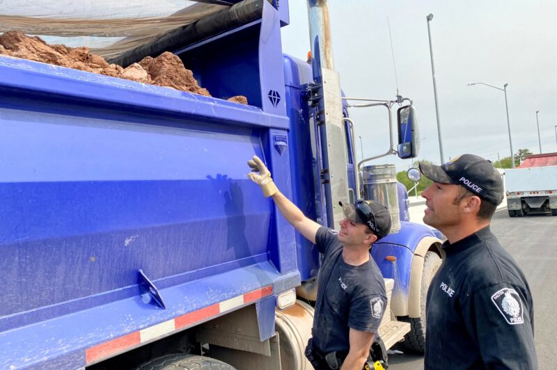 Officers outside a truck