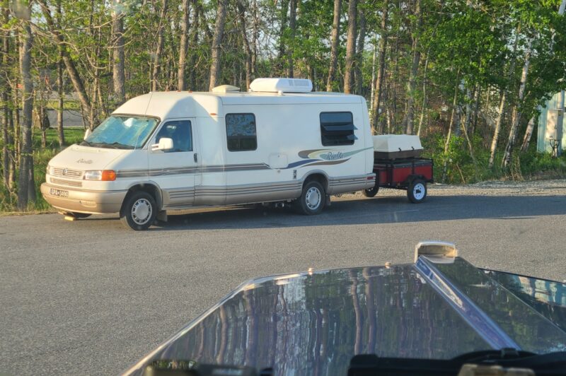 Picture of a camper parked in a spot marked for trucks.