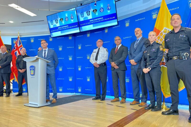 Police officers standing during a press conference