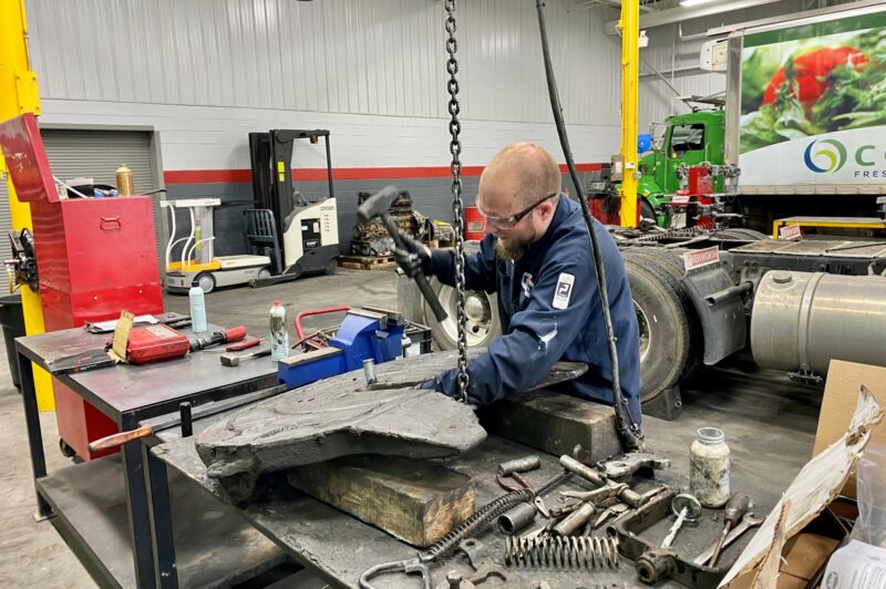 Mechanic works on a fifth wheel
