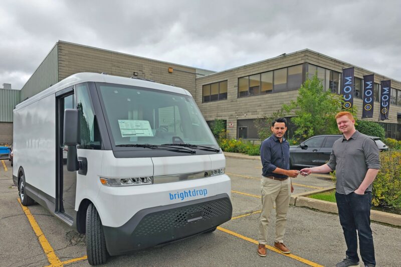 Man delivering keys of a vehicle to another