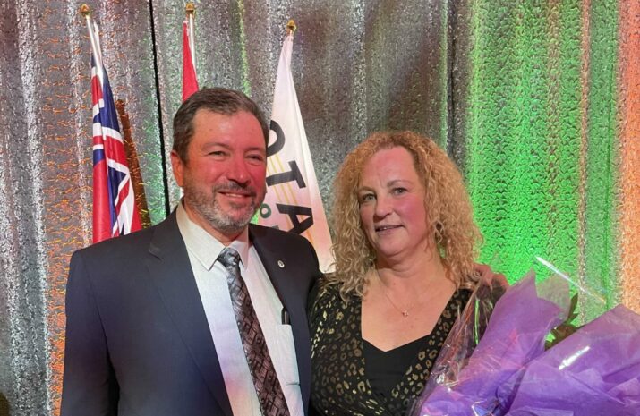 The image is of Dawna Jacobsen and Erb Transport CEO, Wendell Erb