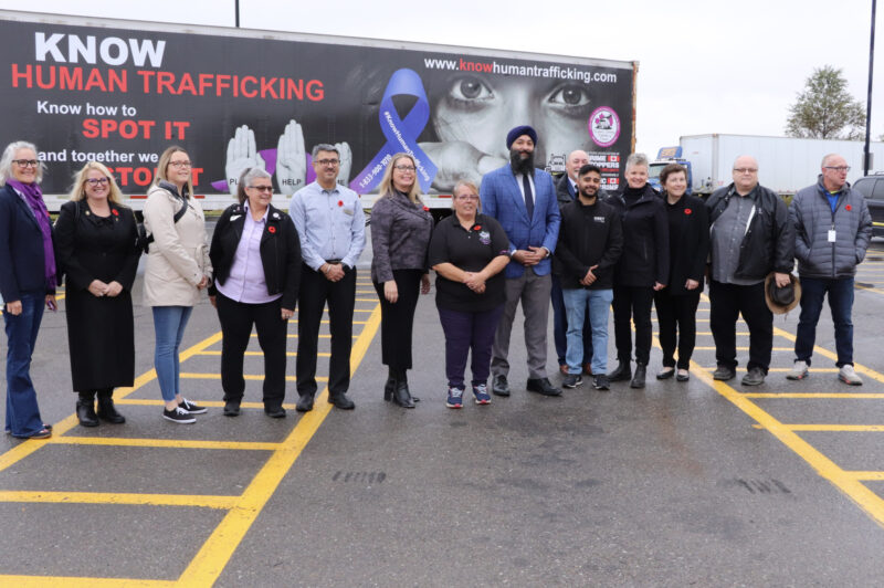 People standing in front of a trailer