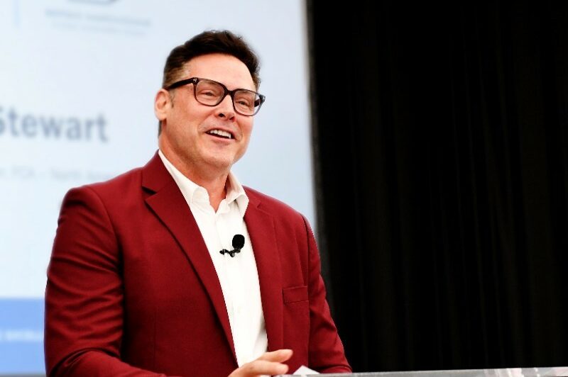 The photo is of Mark Stewart speaking at a conference