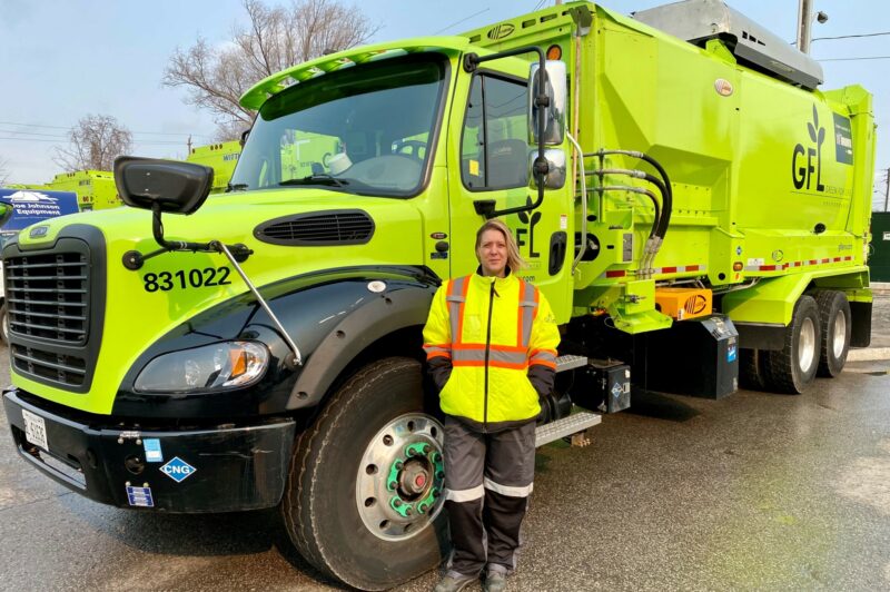 Woman in front of a truck