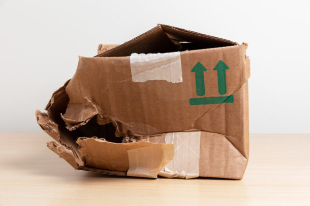 crumpled cardboard mail box alternate text for this image