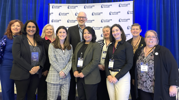 This is a group photo of the nine panelists on 10 years - 10 perspectives panel, and a moderator, John G Smith