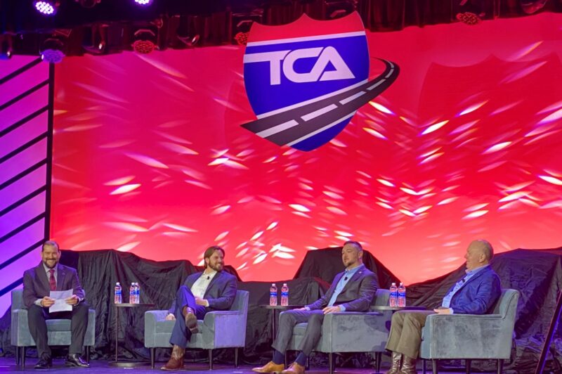 Four men sitting on stage during Truckload 2024