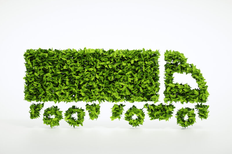 Ecology logistics concept. 3D illustration of a green truck isolated on white.