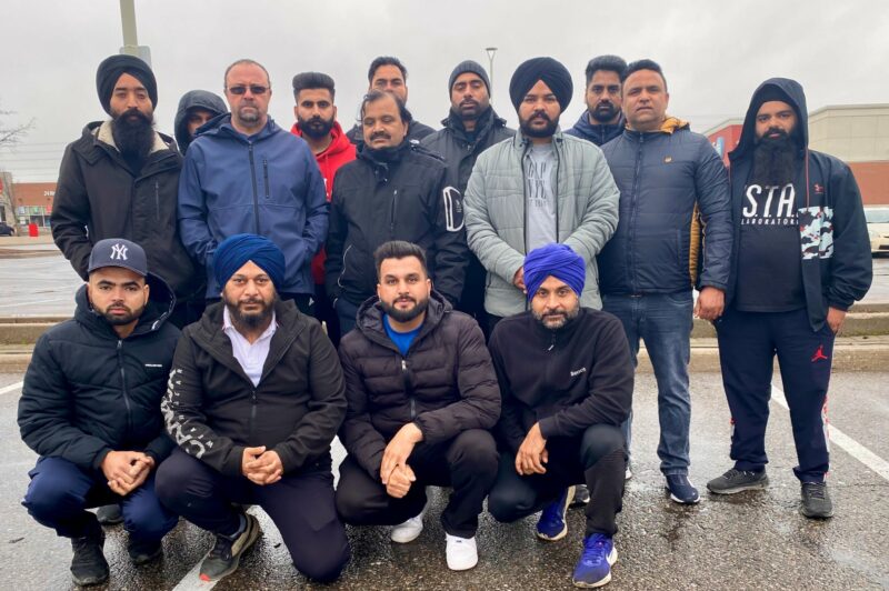 Picture of men in a parking lot