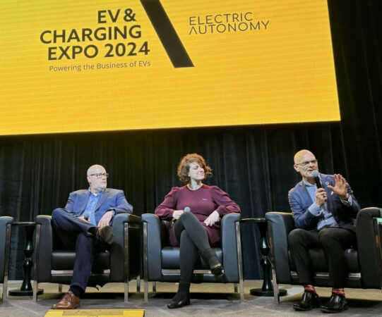 Left to right: Chris Henry, fleet director at Purolator; Gabriela Favaron, EV infrastructure director at 7Gen; Robert Safrata, CEO, Noxev Delivery Solutions on the stage