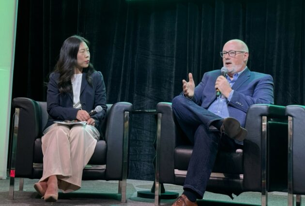Carolyn Kim, corporate affairs director at UPS and Chris Henry Purolator, fleet director, on the stage