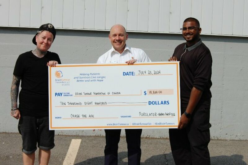 Purolator presenting a cheque for $10,000