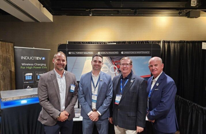 Four men pose for a picture