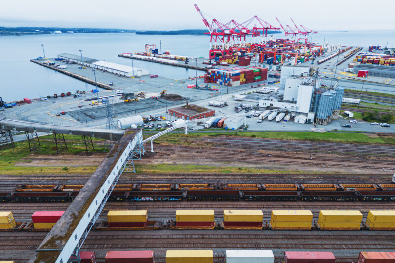 Aerial drone view of a railyard & container dock.