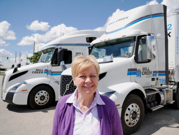 Renate Hargreaves in front of a truck