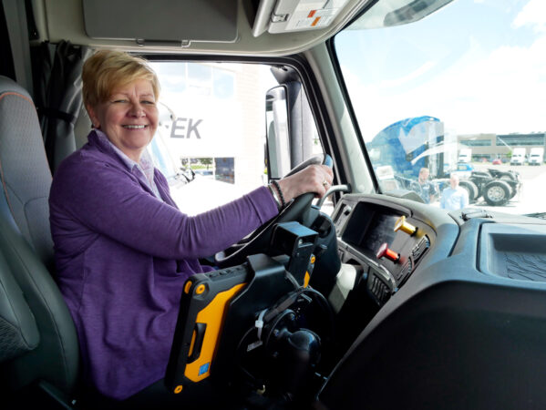 Renate Hargreaves in a truck behind the wheel