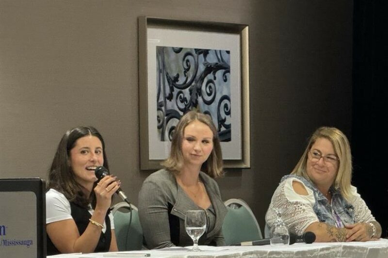 three panelists at the table, close-up