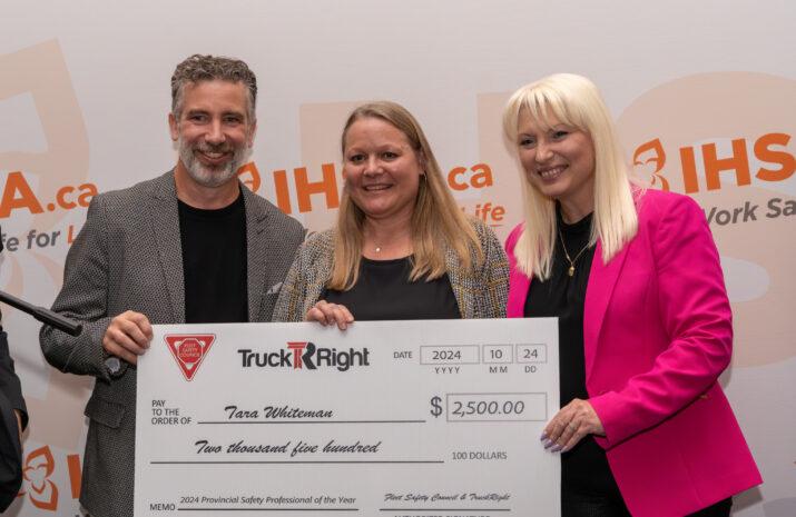 Tara Whiteman, middle, with Rick Brown and Eugenia Churilov presenting her with the check