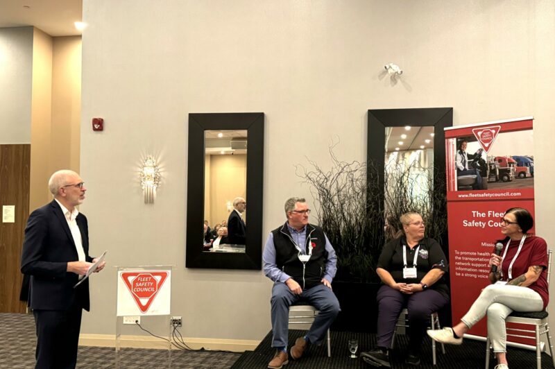 John G Smith of Newcom Media moderating a panel at FSC conference.