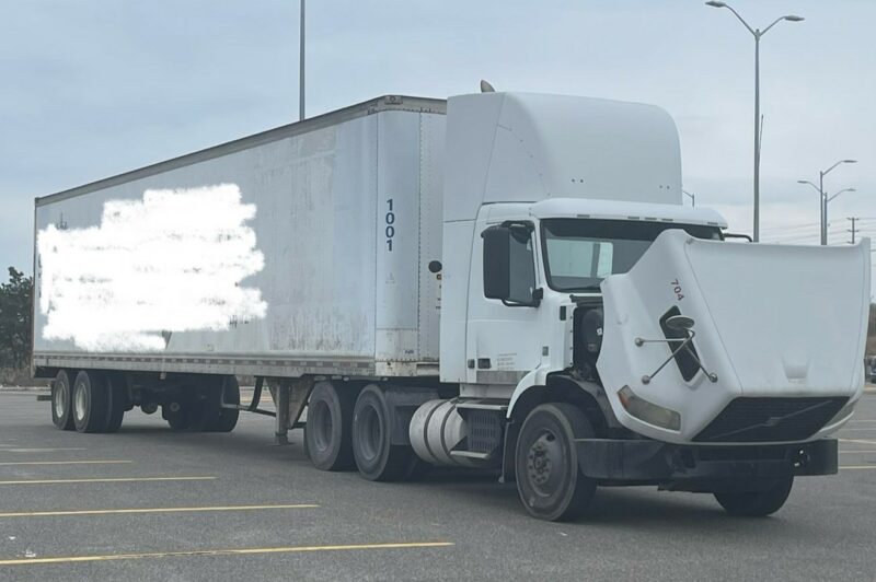A truck with a hood open