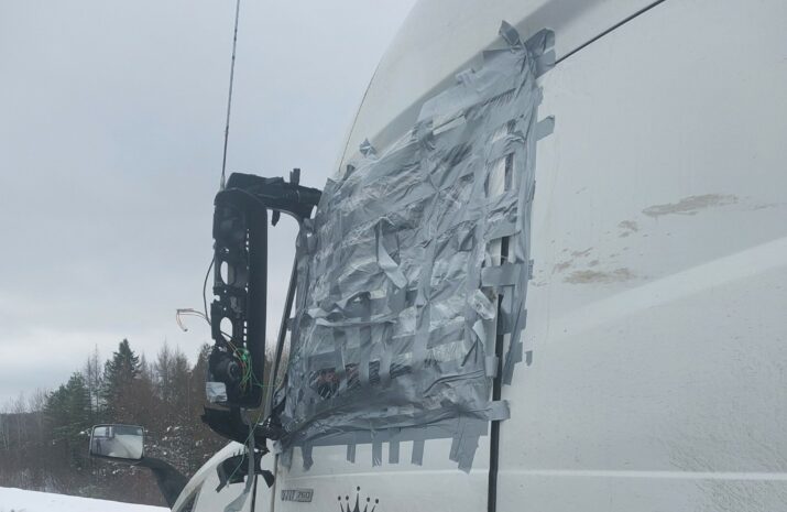 Truck with duct-taped window