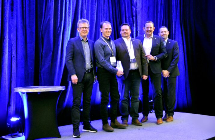 Men standing on a stage