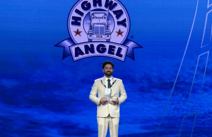 Daljit Sohi on stage with his award