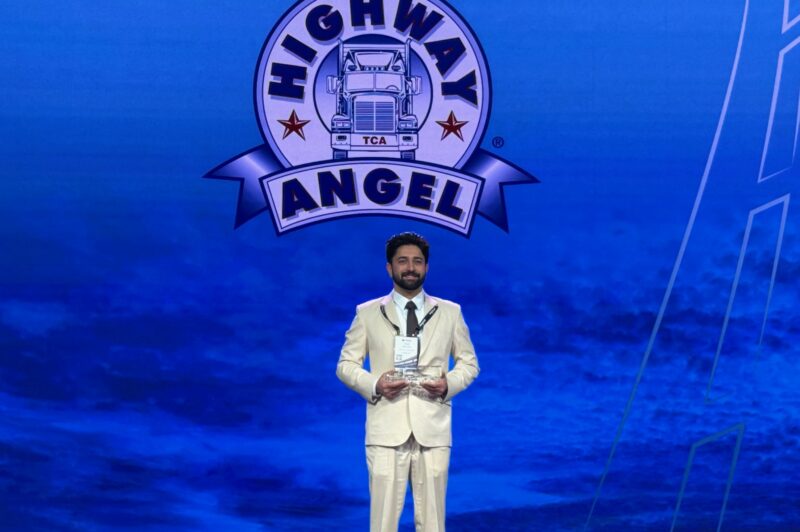 Daljit Sohi on stage with his award